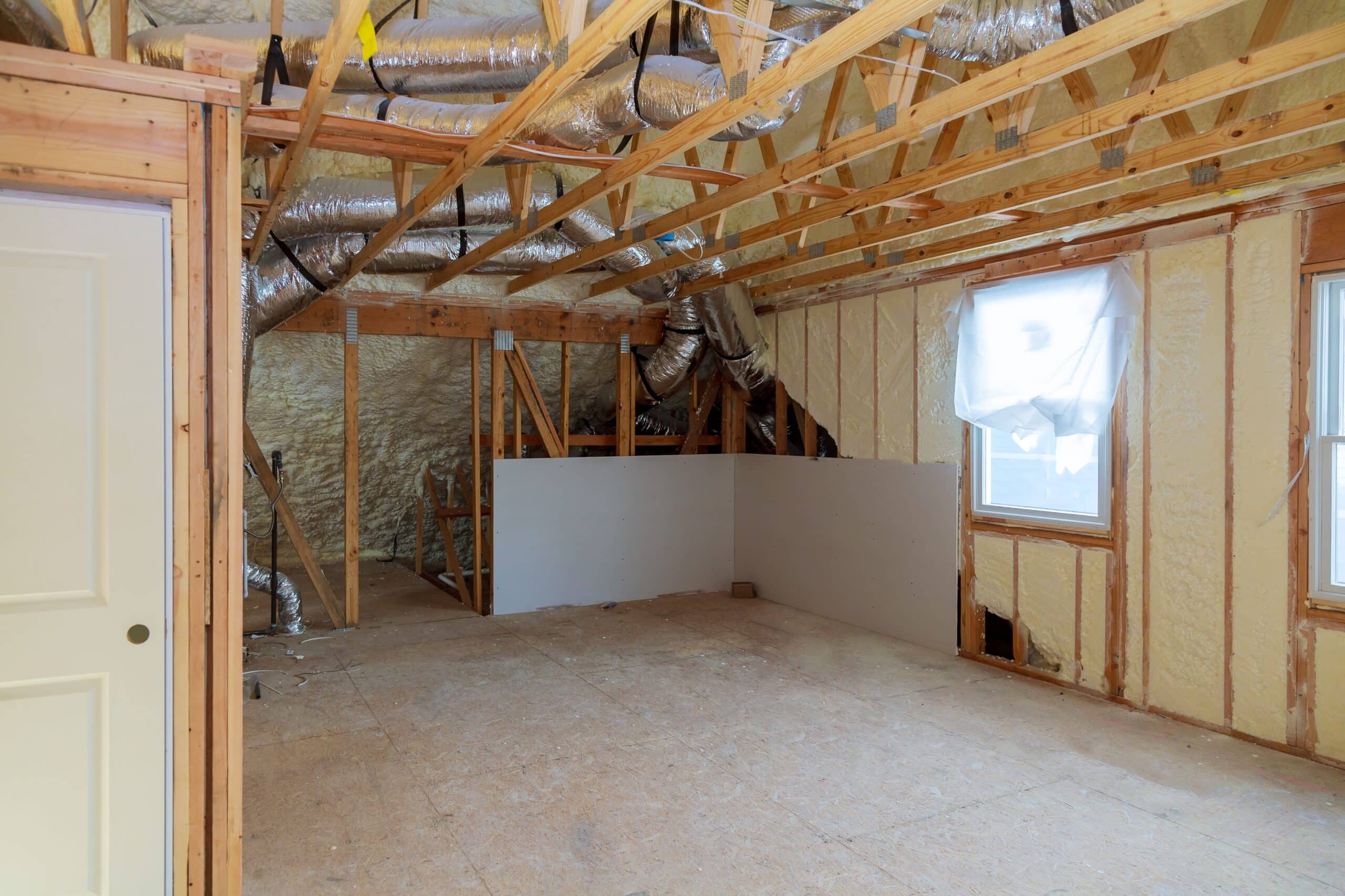 a room at a newly constructed home sprayed with liquid insulating foam