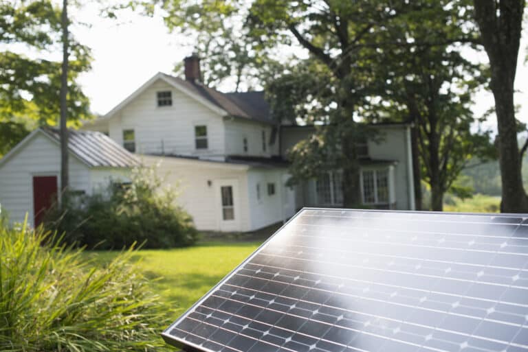 summer gathering,a solar panel in a farmhouse garden.