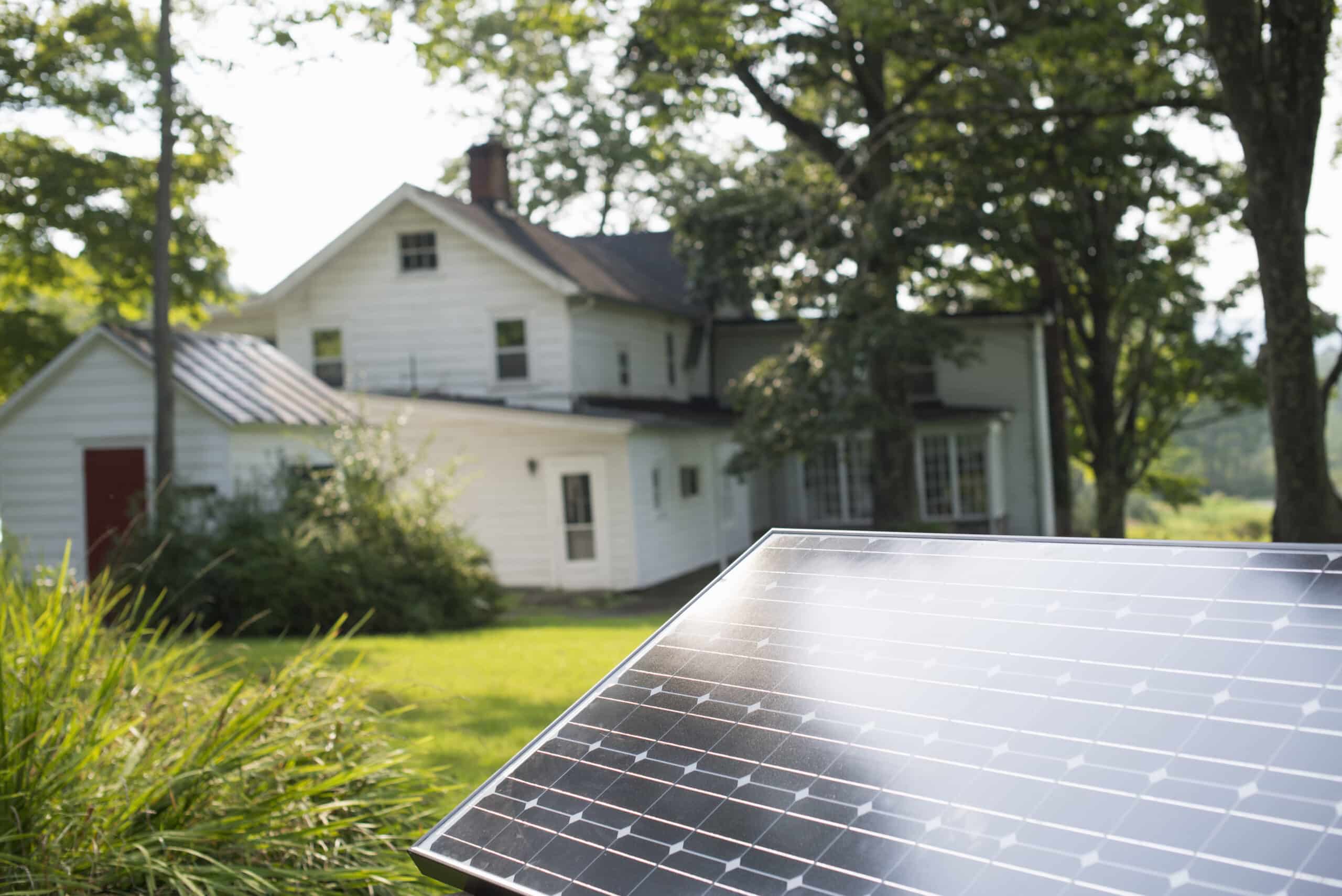 summer gathering,a solar panel in a farmhouse garden.