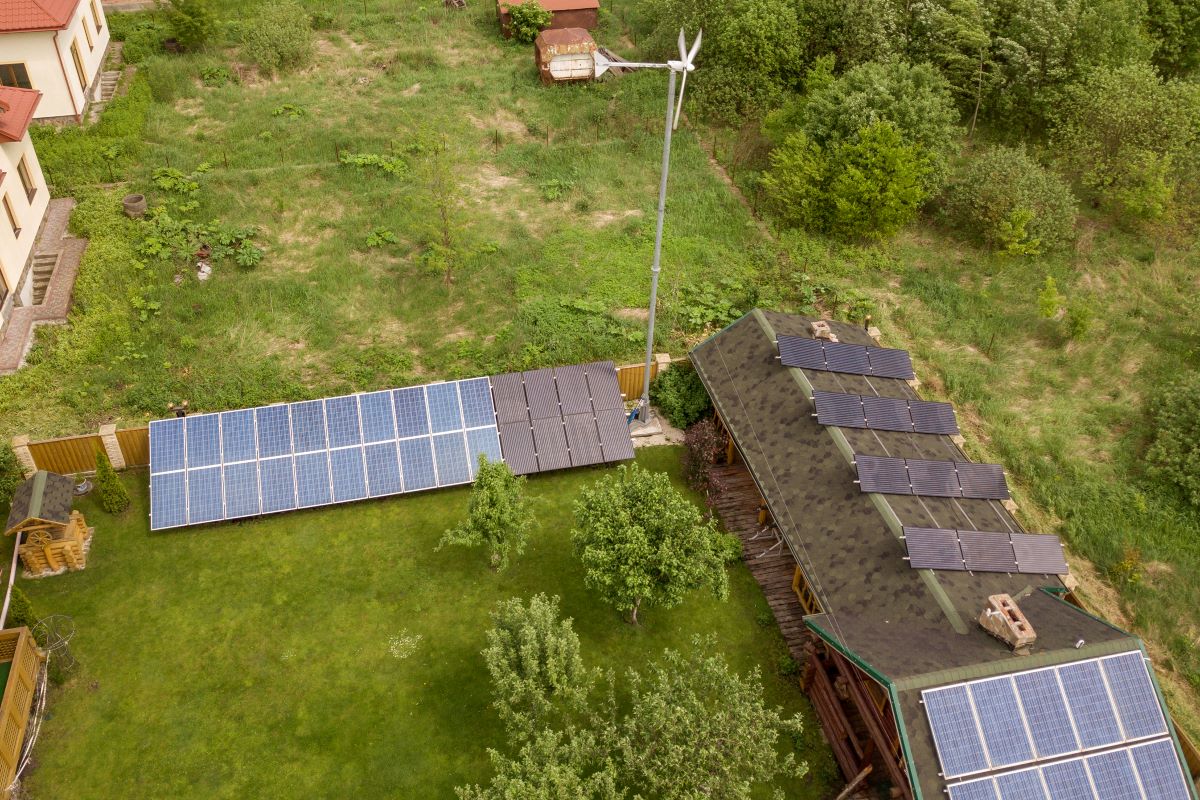 aerial view of a barn with solar panels on roof an 2022 07 22 07 47 00 utc