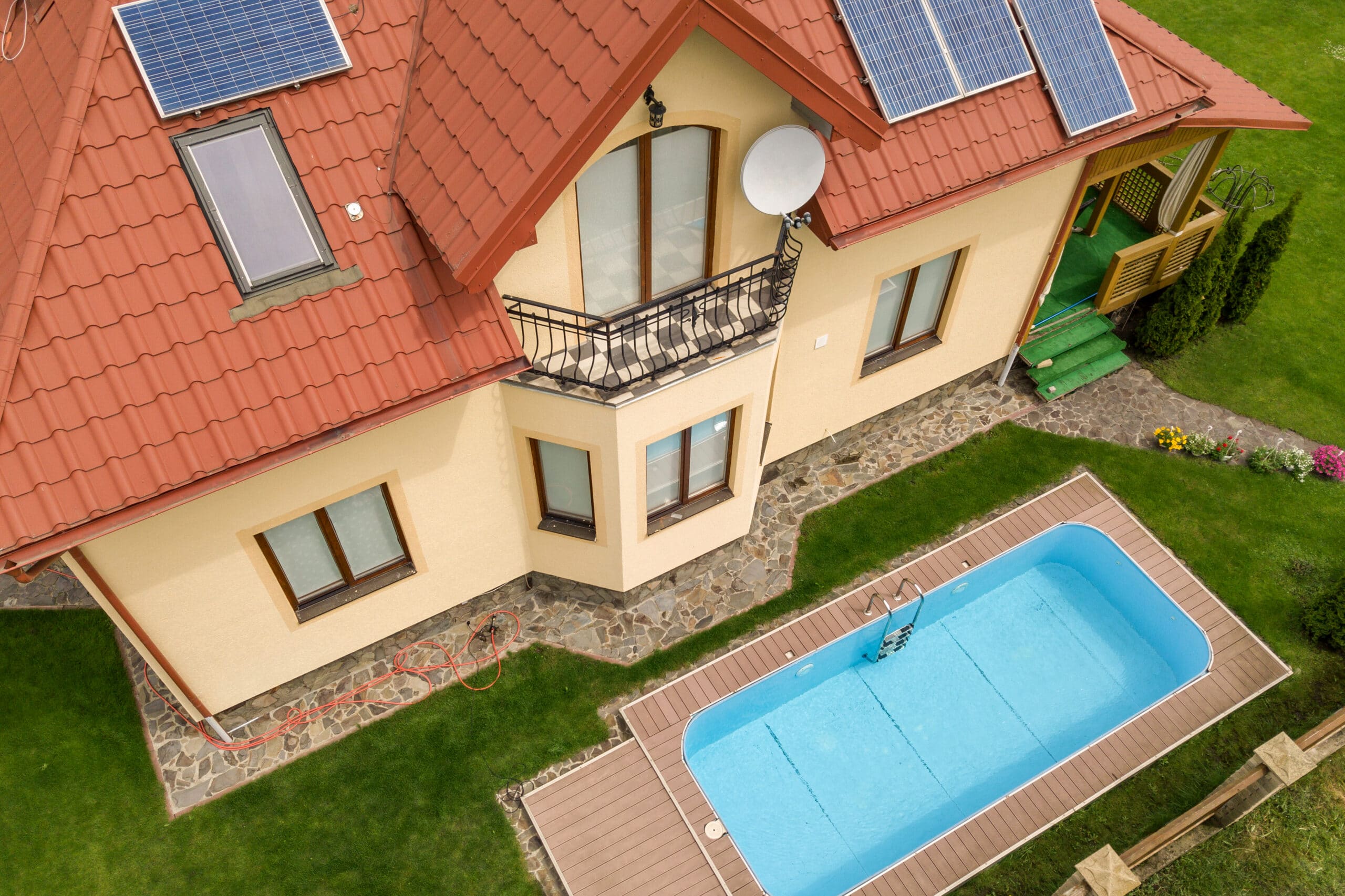 aerial view of a new autonomous house with solar panels and wate