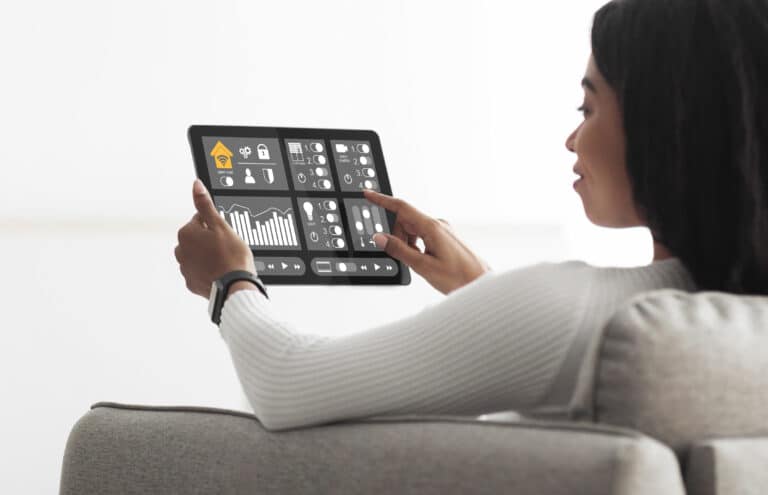 african american woman using smart home automation assistant