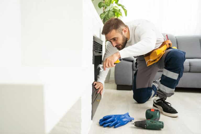 building master examines a new fireplace