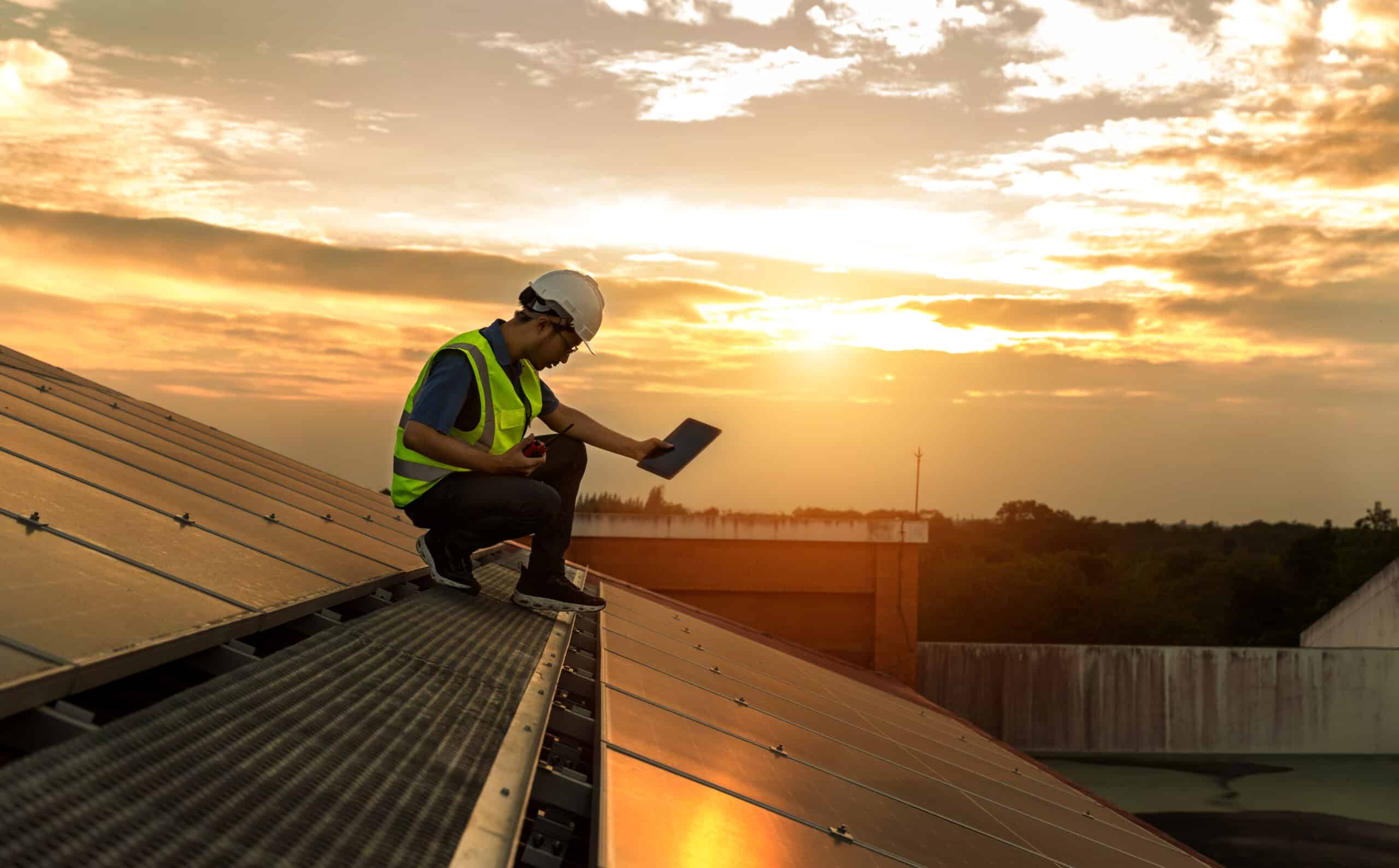 engineer working setup solar panel at the roof top. engineer or