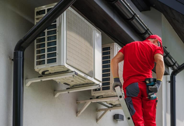 heating and cooling technician performing scheduled maintenance