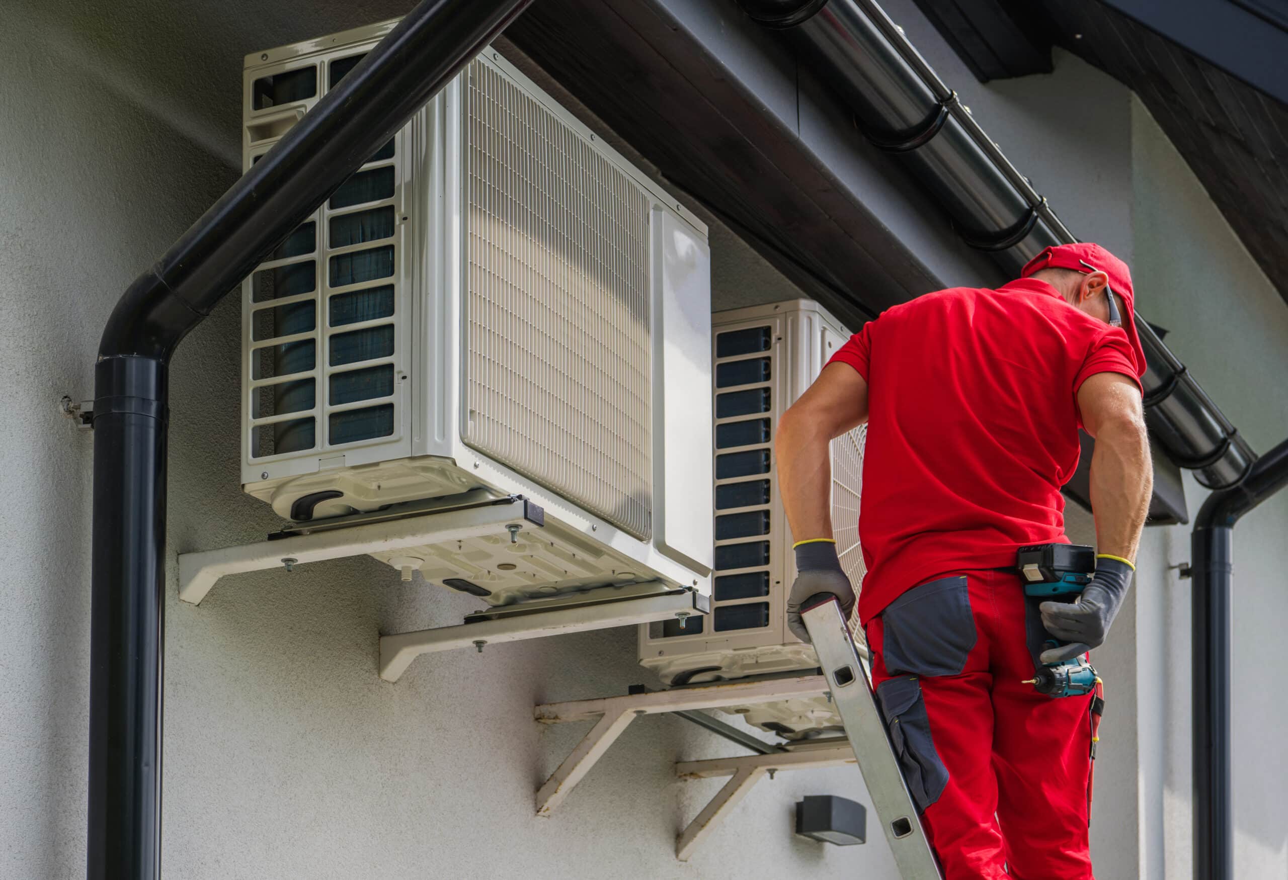 heating and cooling technician performing scheduled maintenance