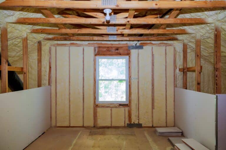 insulation of attic with fiberglass cold barrier and insulation material