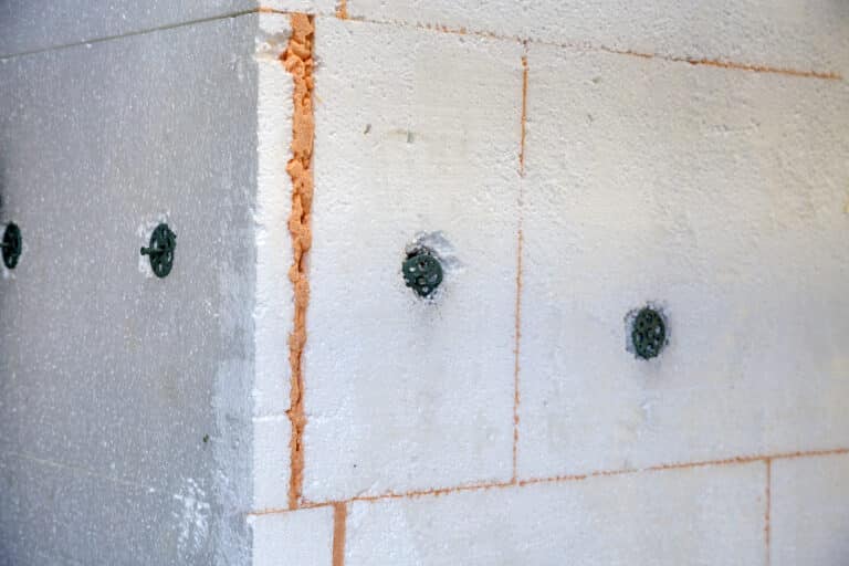insulation work of house walls with styrofoam sheets.