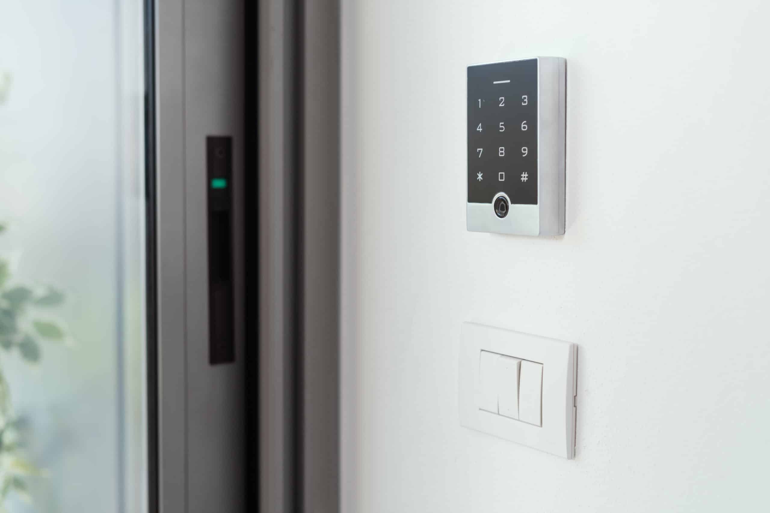 man setting an alarm code for home security