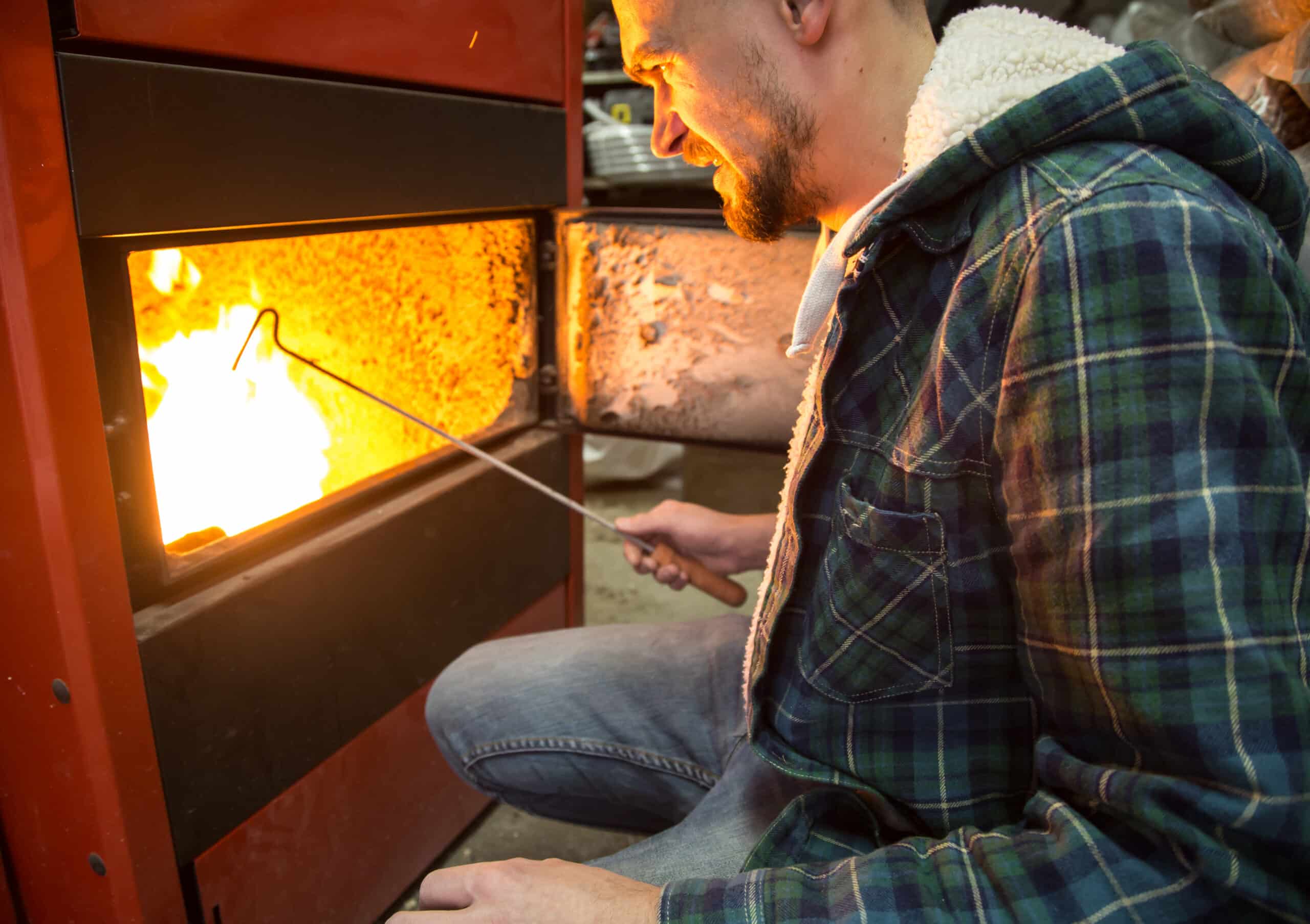 people working in the boiler on solid fuel
