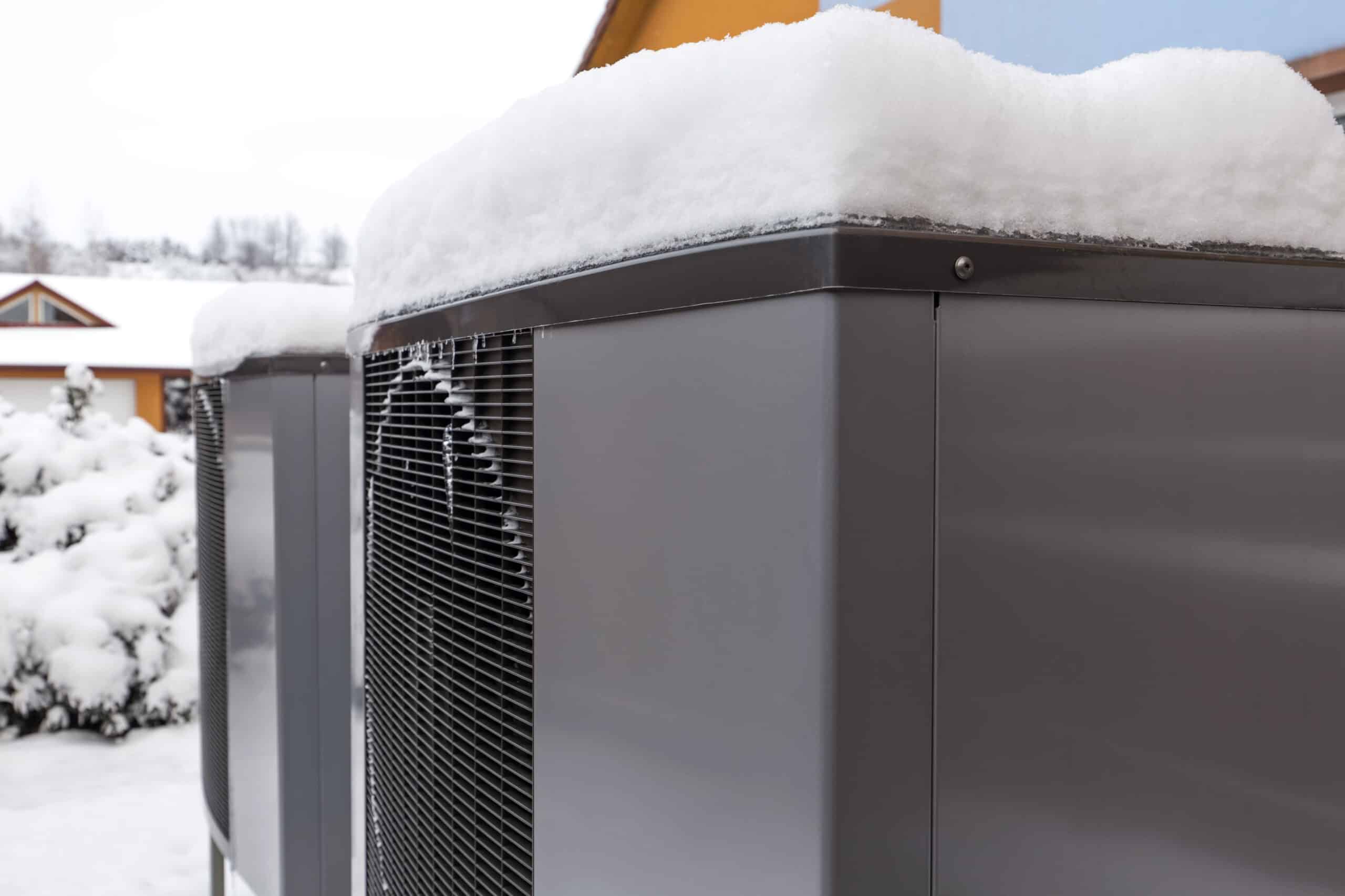 two residential modern heat pumps