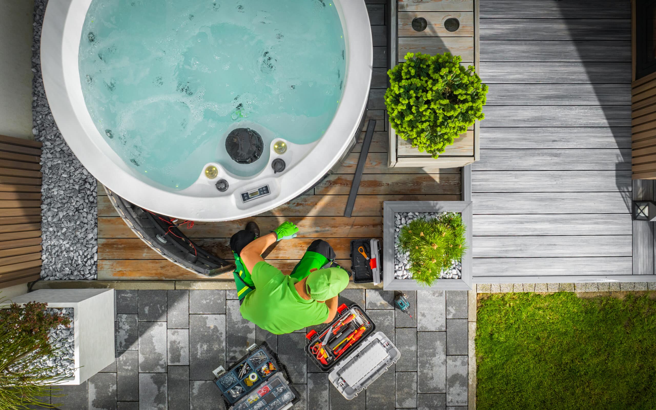 aerial view of hot tub technician performing garden spa repair