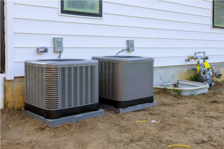 air conditioning system unit installed outside facade of the new house