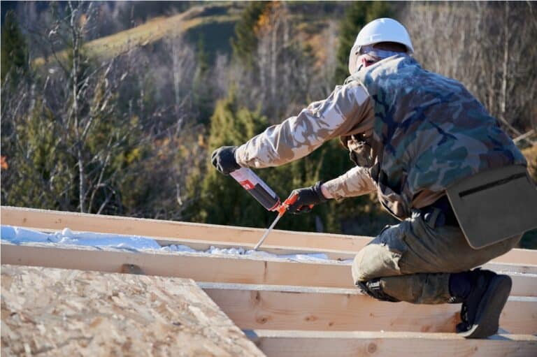 male builder doing thermal insulation on roof of w 2022 08 19 07 12 09 utc
