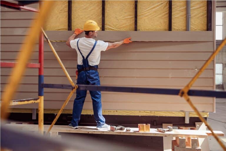 male worker building cabin at construction site 2021 12 09 11 33 29 utc