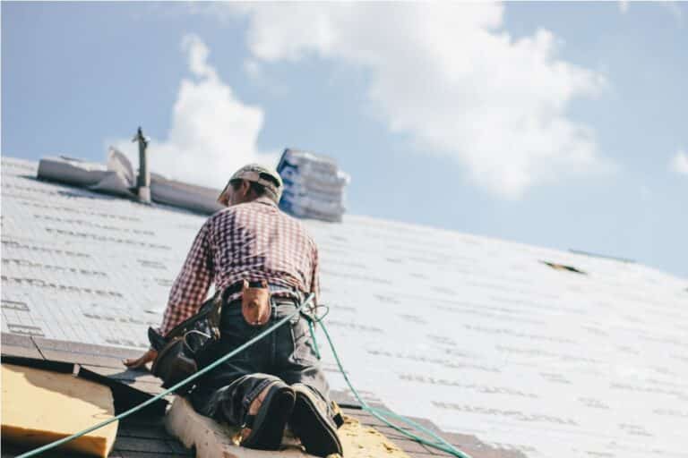 roofer adding shingles to the roof of a house 2022 11 16 18 35 52 utc