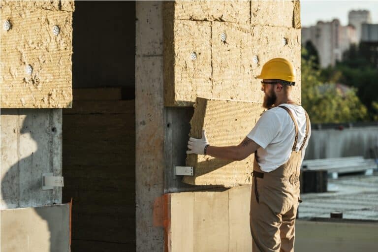 side view of builder in protective helmet and goog 2022 12 16 19 41 32 utc
