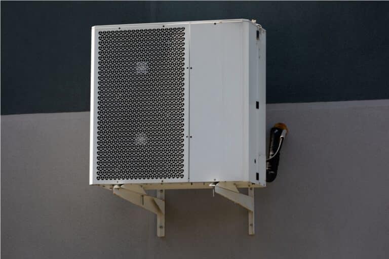 cooling unit for duct air conditioner hanging on the wall of the building.