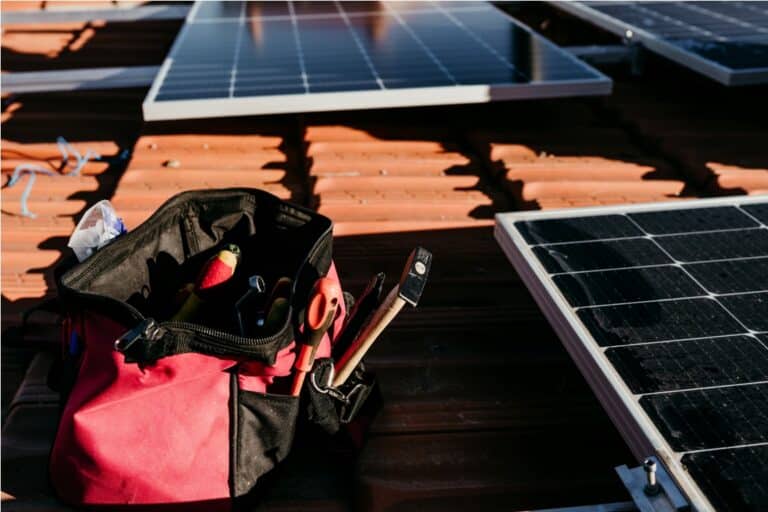 bag of technician tools and solar panel on roof du 2022 10 11 20 15 32 utc