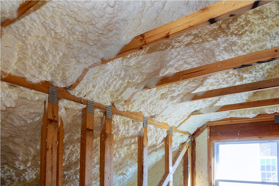 closeup on termal insulation installing at the attic insulation of the house