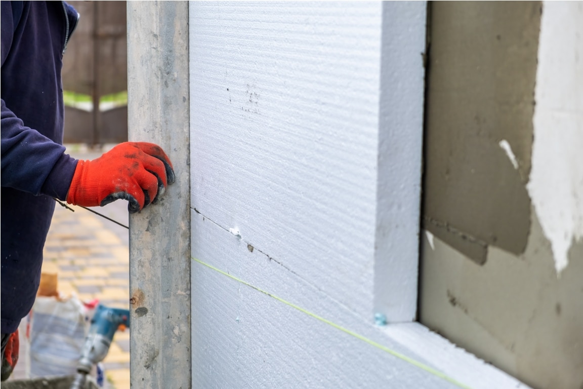 construction worker installing styrofoam insulatio 2023 08 19 06 05 12 utc