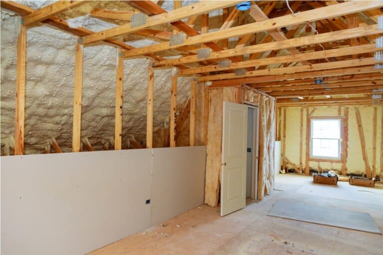 termal insulation installing at the attic insulation of the house