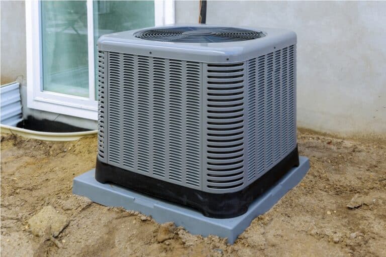 air conditioning system unit installed outside facade of the house