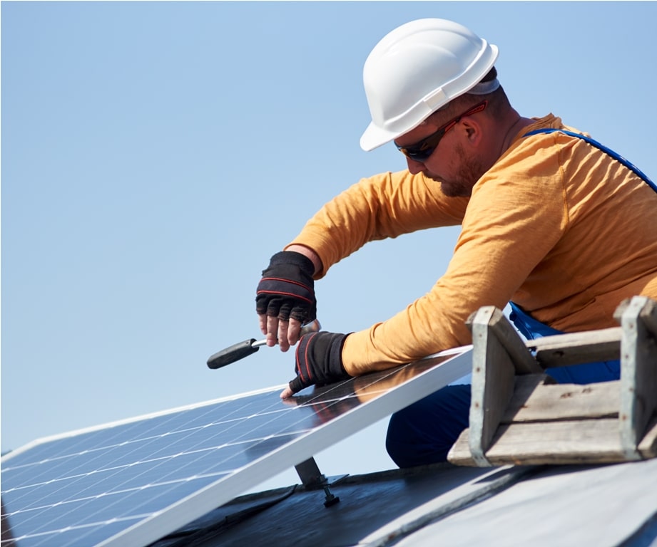 electrician mounting solar panel on roof of modern 2022 05 16 16 02 27 utc