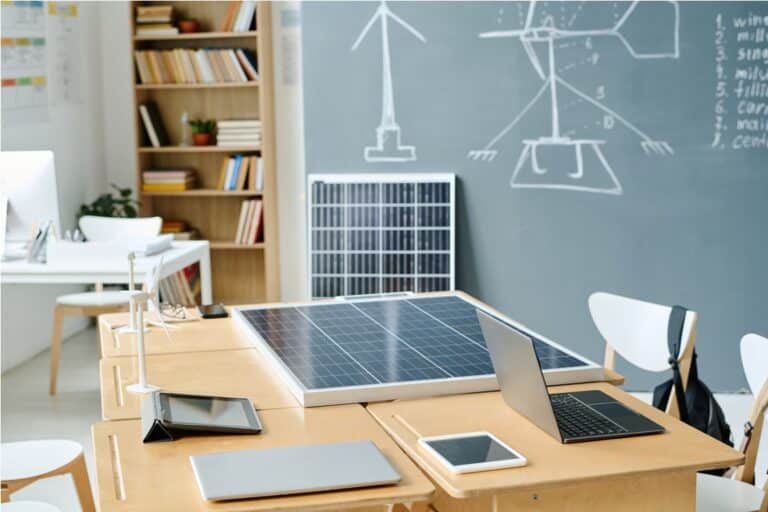 empty classroom with solar panel on table at school