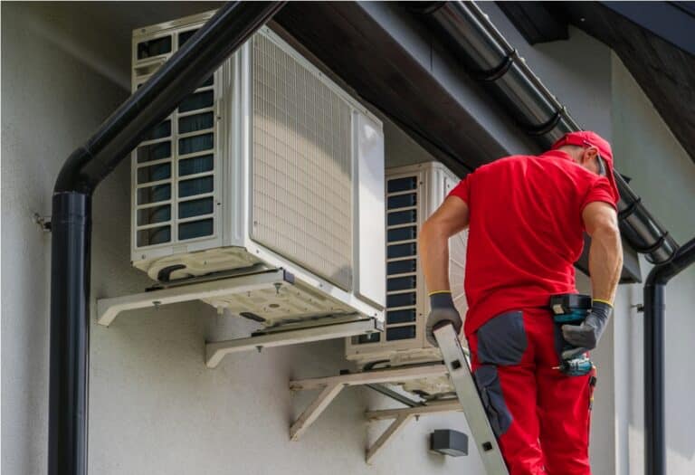 heating and cooling technician performing scheduled maintenance