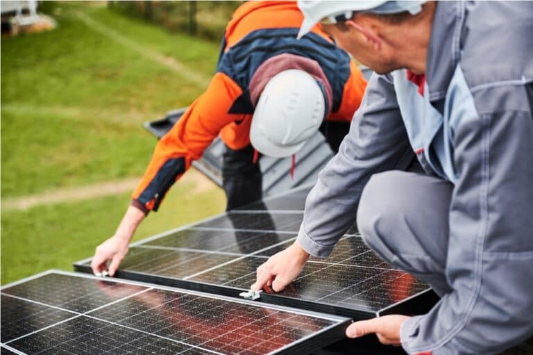 men workers installing solar panels on roof of hou 2023 09 29 17 18 15 utc