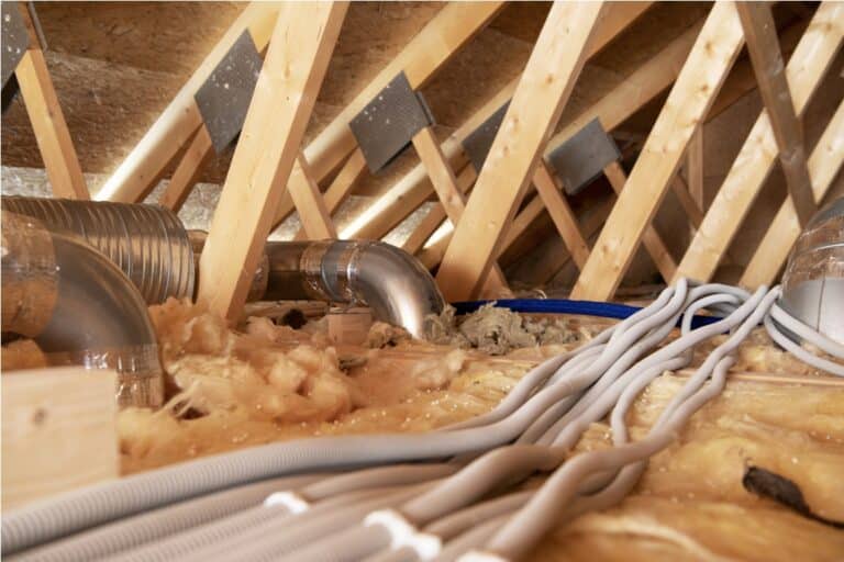 residential attic with air shafts and electric installations