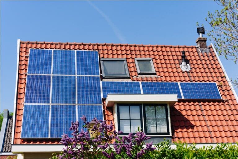 solar panel on a red roof reflecting the sun and t 2022 11 29 20 20 49 utc