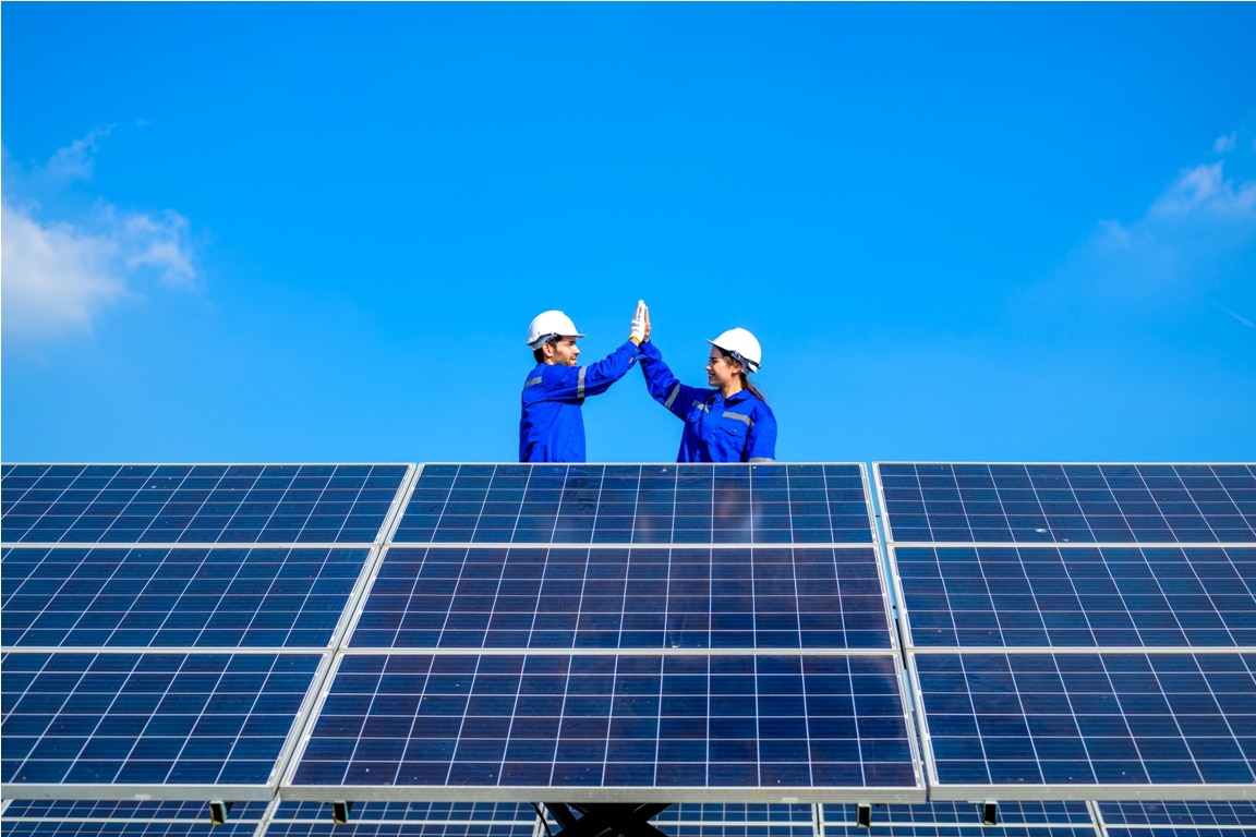 solar panel station, engineer installing solar panel at solar energy farm field