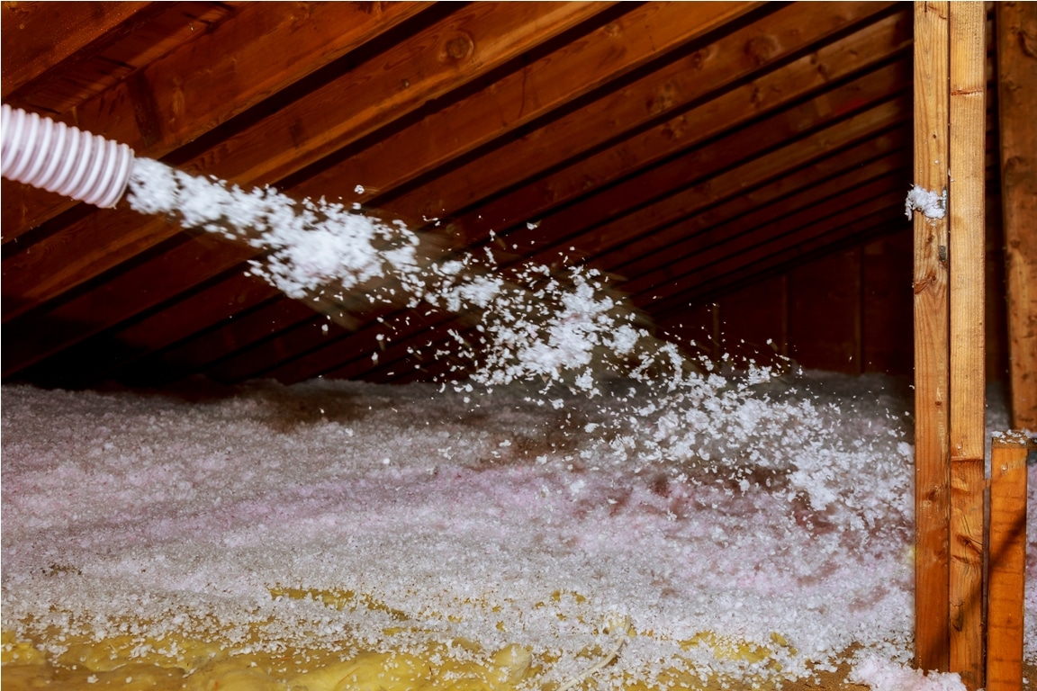 worker spraying mineral rock wool of thermal insul 2022 11 12 10 00 28 utc