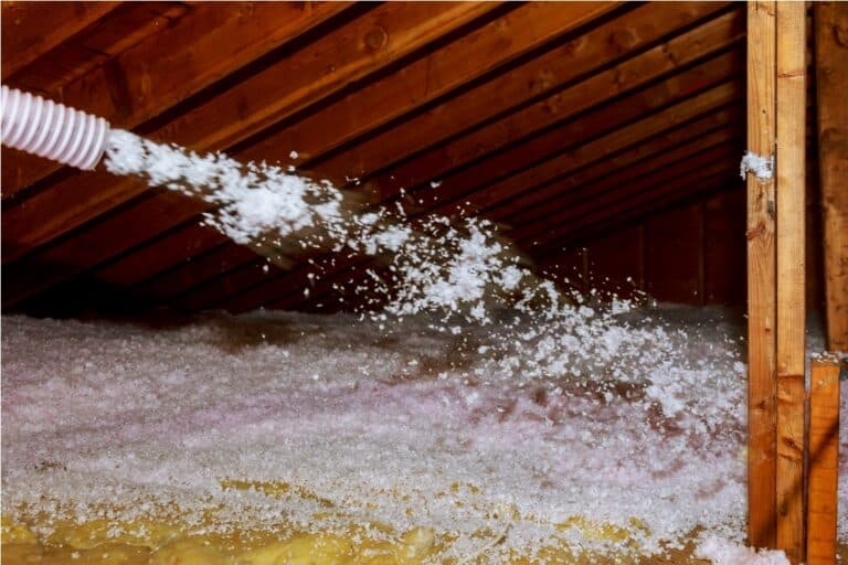 worker spraying mineral rock wool of thermal insul 2022 11 12 10 00 28 utc