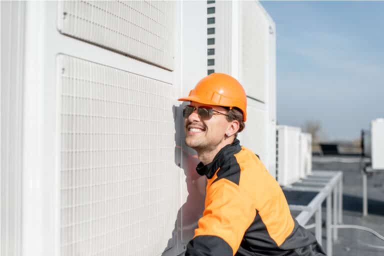 workman installing outdoor unit of the air conditi 2021 09 02 01 01 35 utc