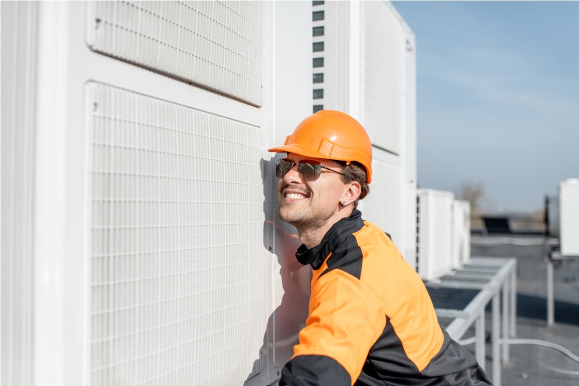workman installing outdoor unit of the air conditi 2021 09 02 01 01 35 utc